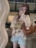 Ảnh của Set áo be chữ mix quần jean